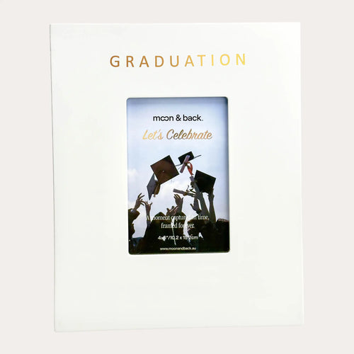 White matte signature photo frame, with "GRADUATION" foil-stamped in widely spaced gold capitals across the broad top border and a portrait photo aperture below, leaving wide blank white panels either side for signatures.