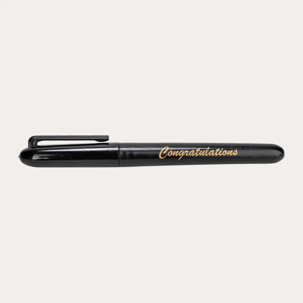 Capped black gloss permanent marker shown side on against white, printed "Congratulations" in gold italic script along the barrel, with a moulded black pocket clip and rounded ends.