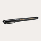 The reverse of the same black gloss marker, showing a small gold logo and web address print along the barrel and the moulded pocket clip from the opposite side.